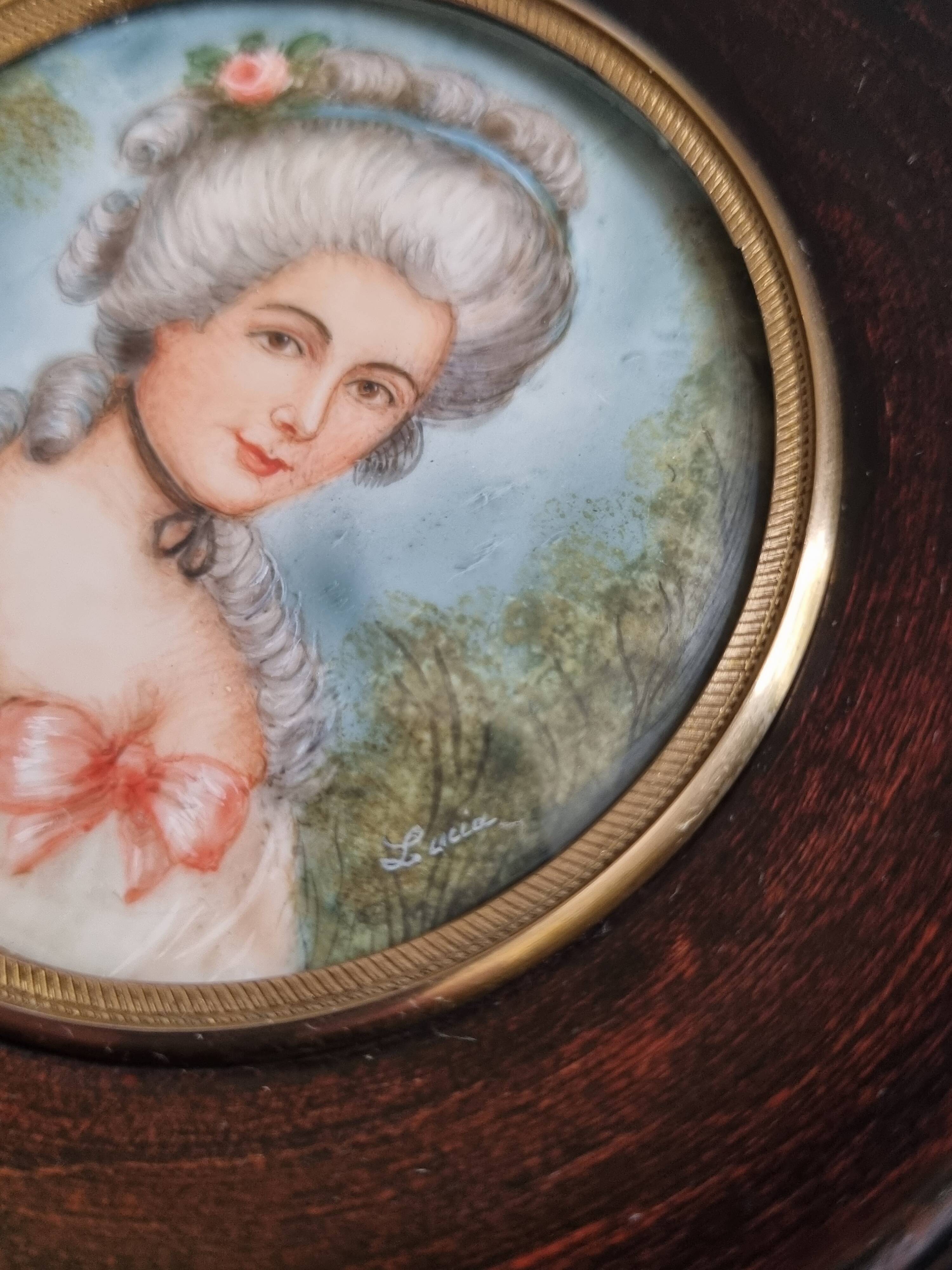 Miniature portrait of a woman in the style of Marie Antoinette, signed Lucia, 12 x 12 cm.
