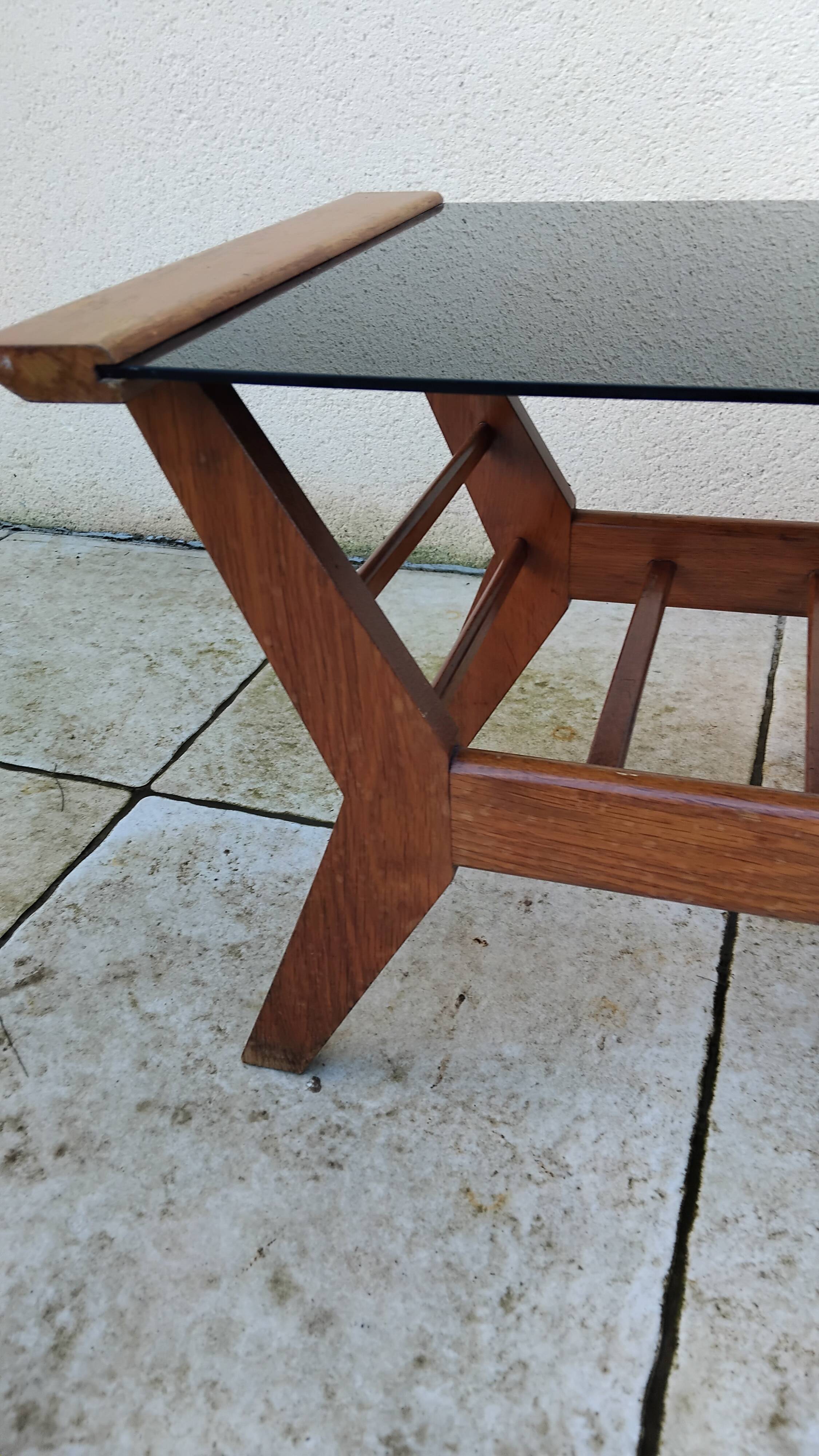 Vintage coffee table from the 1950s reconstruction, wood and glass.