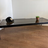 Large designer coffee table from the 70s in chrome, smoked glass, and faux leather.