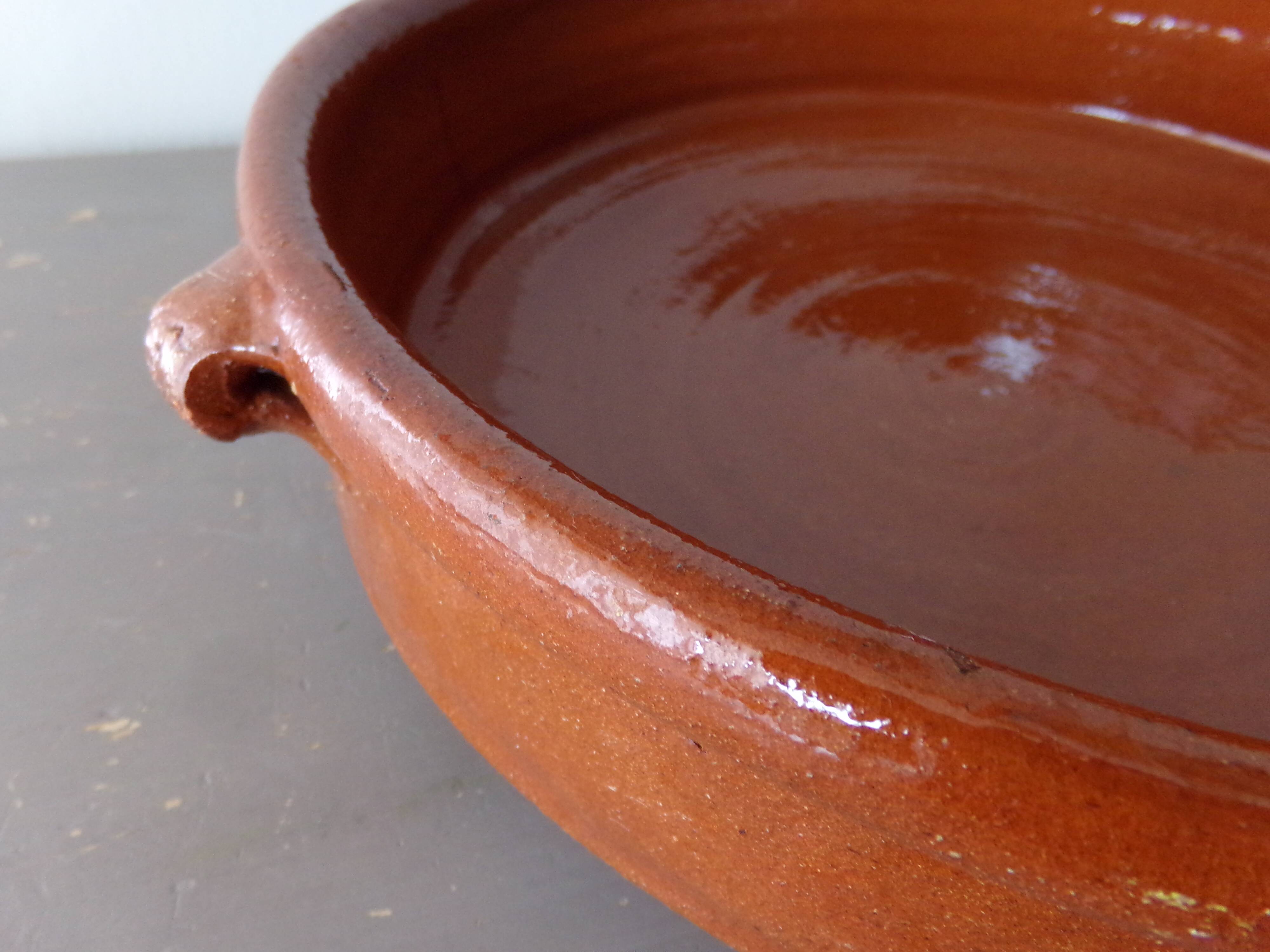 Antique dish in glazed terracotta