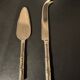 Golden metal cheese cutlery imitating bamboo