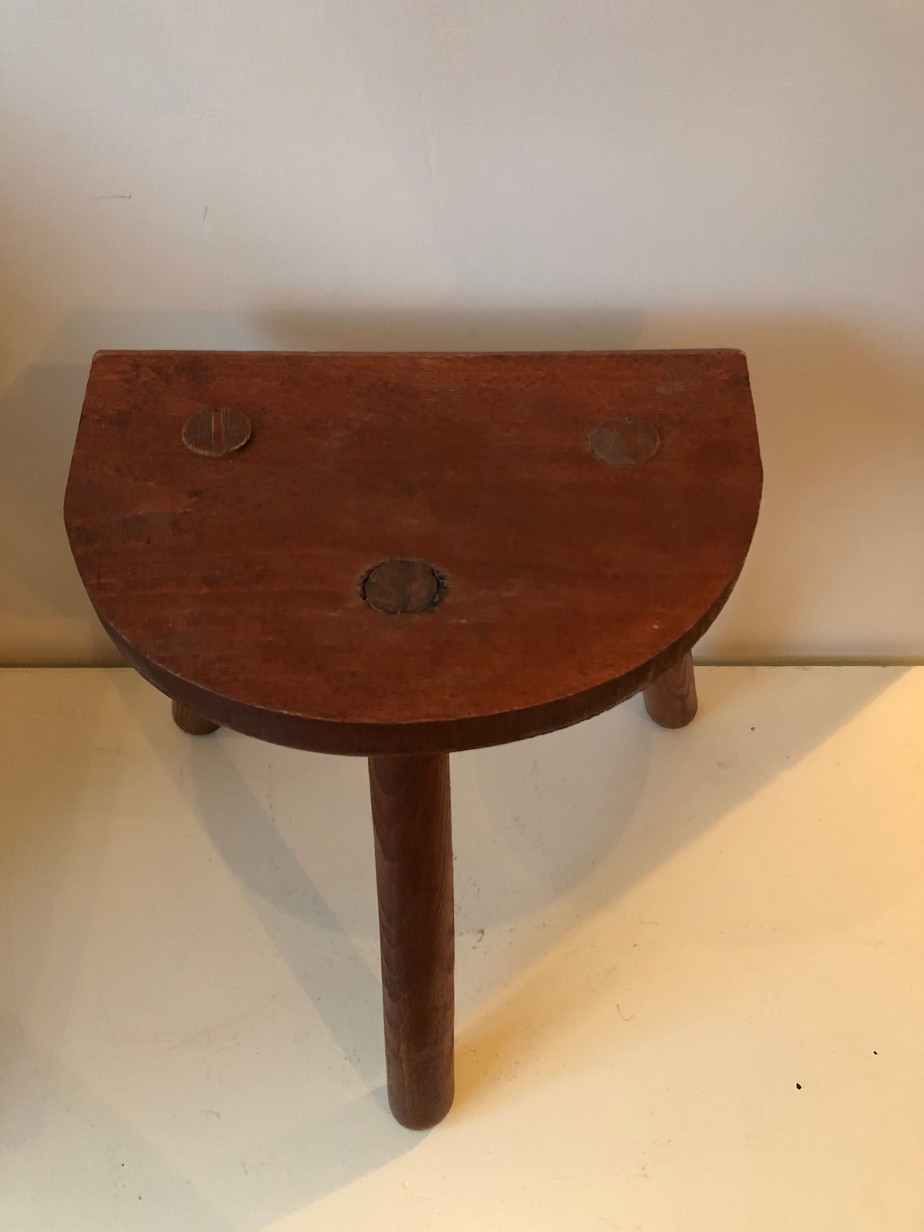 Old wooden tripod stool
