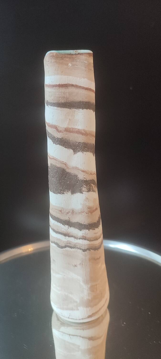 Turned stoneware vase signed with relief decoration.