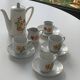 Porcelain dinette for dolls consisting of a coffee maker, cups and saucers, vintage