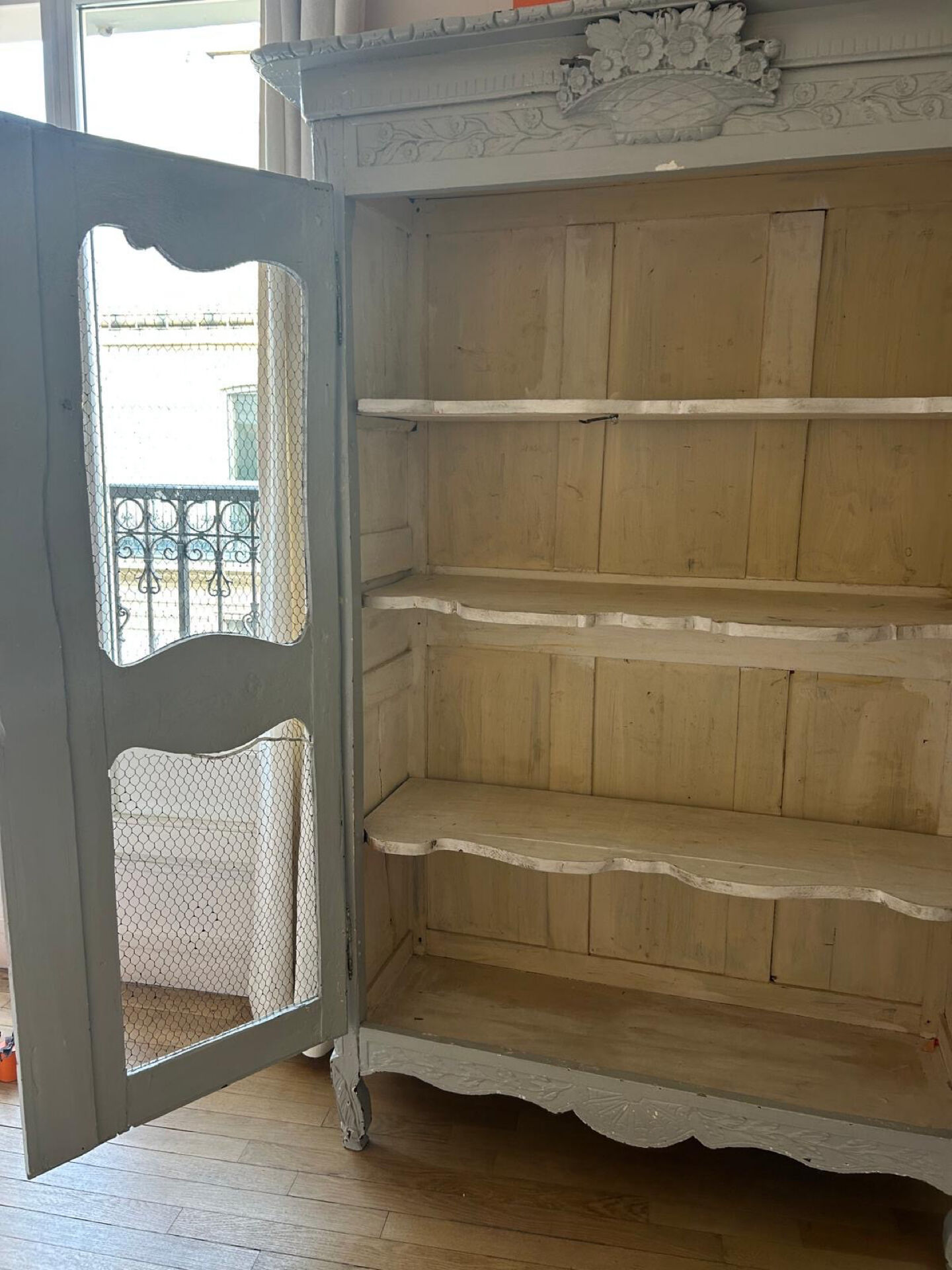 Antique French carved display cabinet with wire mesh doors