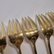 Gold metal fish cutlery, knives and forks 24 pieces