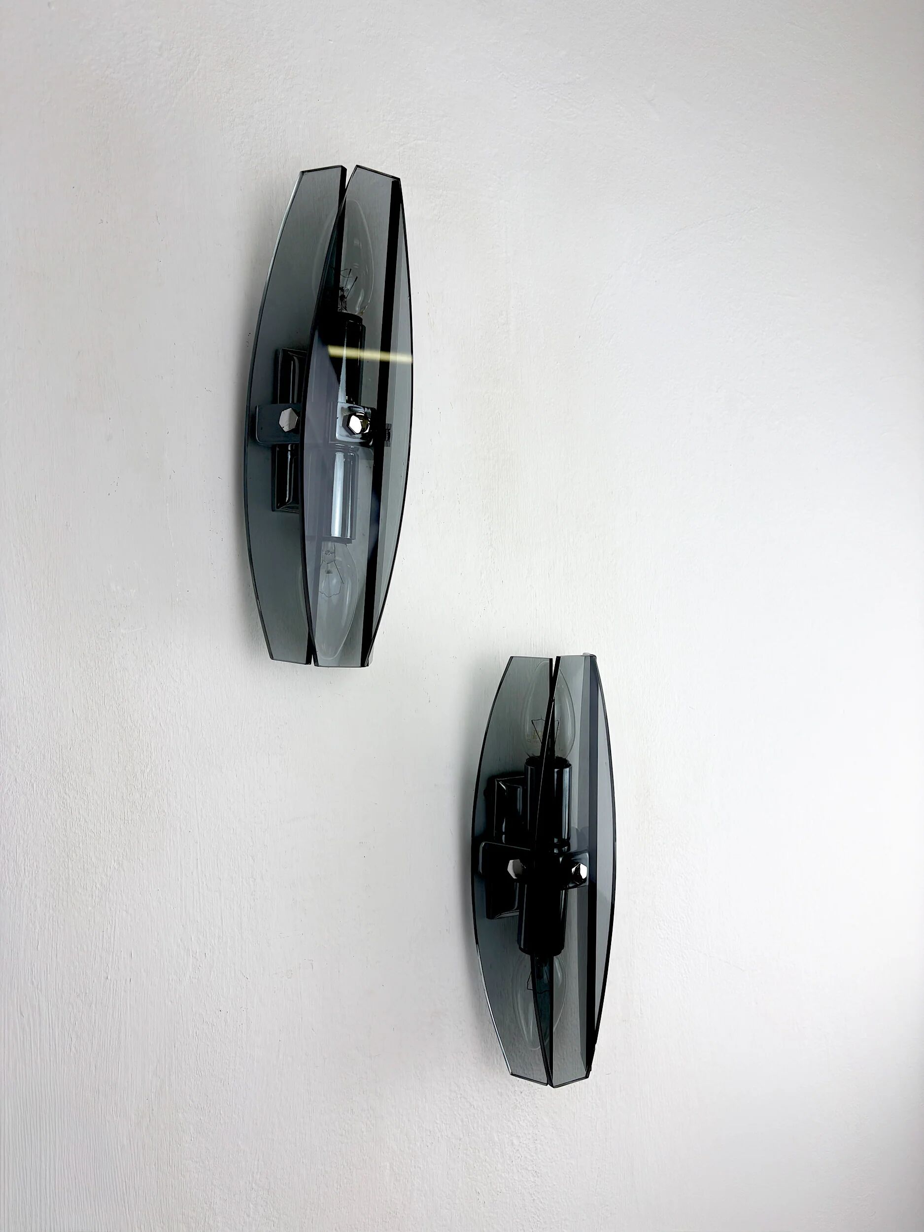 Pair of Veca wall sconces, black Murano glass, Italy, 1970s