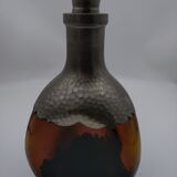 Vintage decanter in glass and tin.