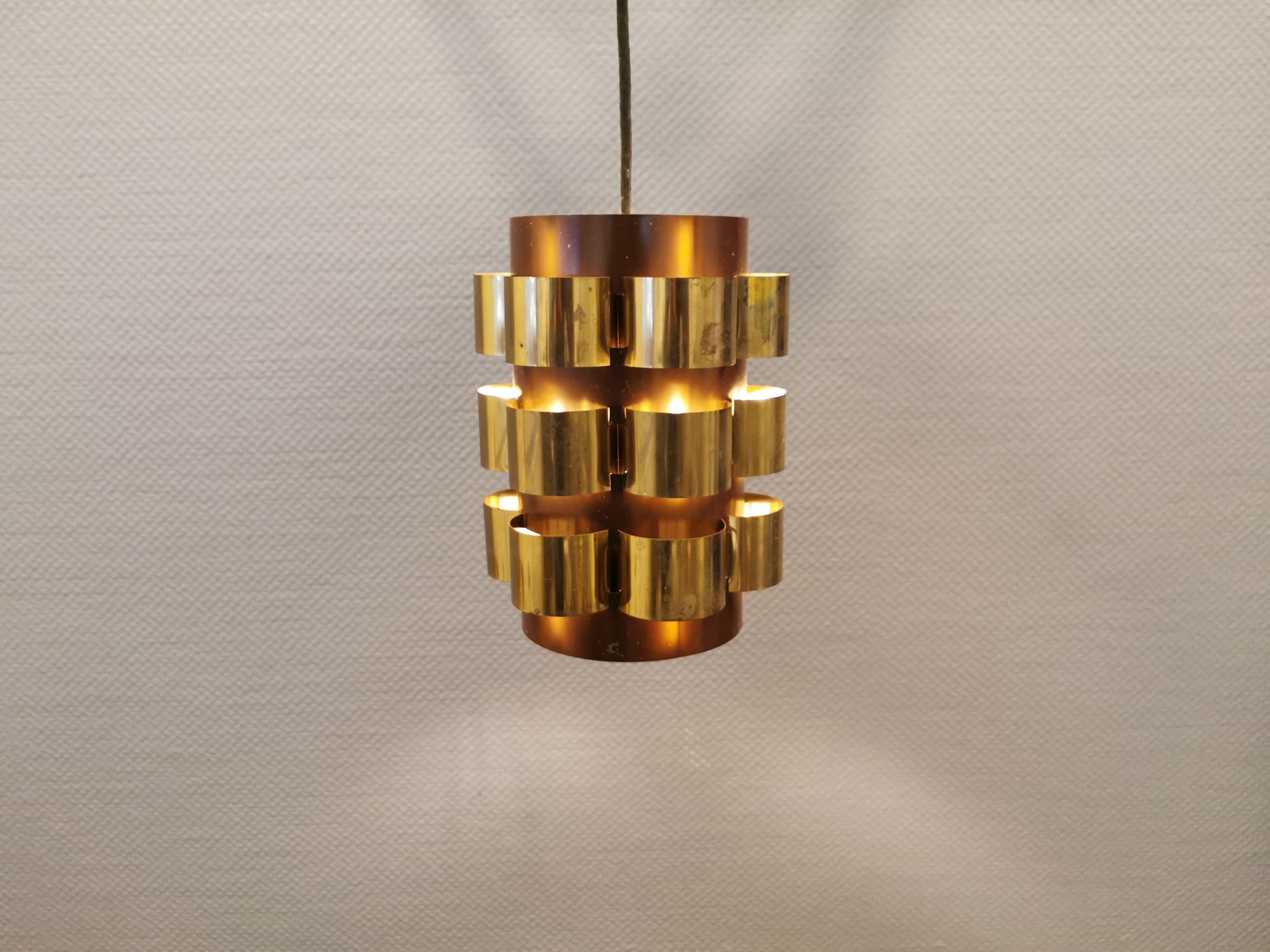 Danish hanging lamp from the 70s, in thin cut metal.