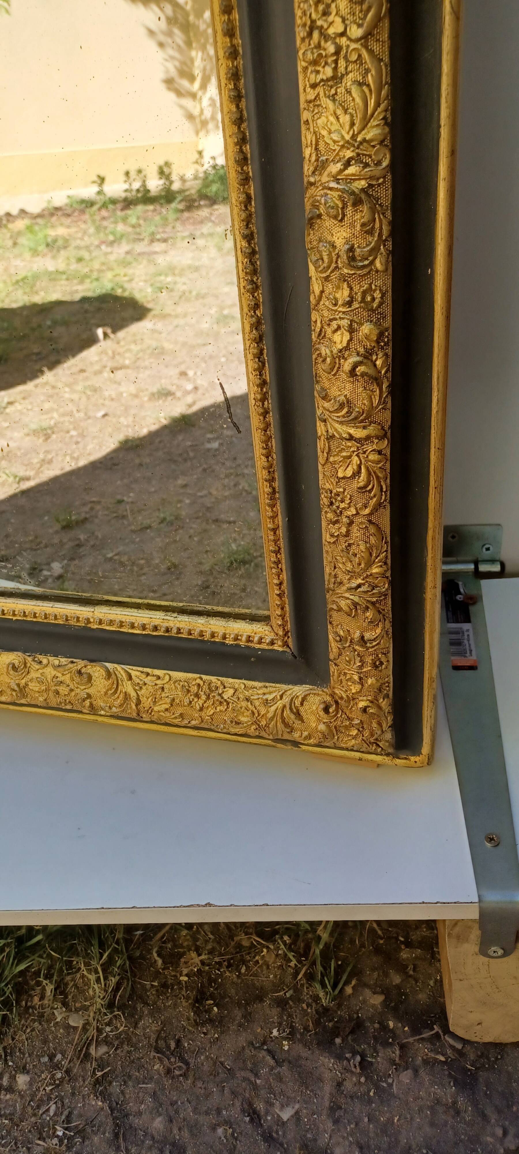 Louis-Philippe mirror, gilded and grey patina, circa 1890.
