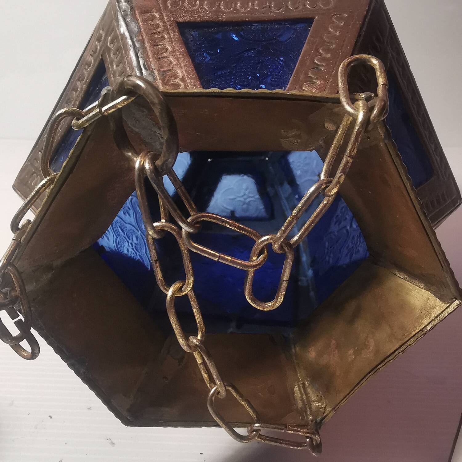 Oriental style hanging lantern in brass and dark blue glass
