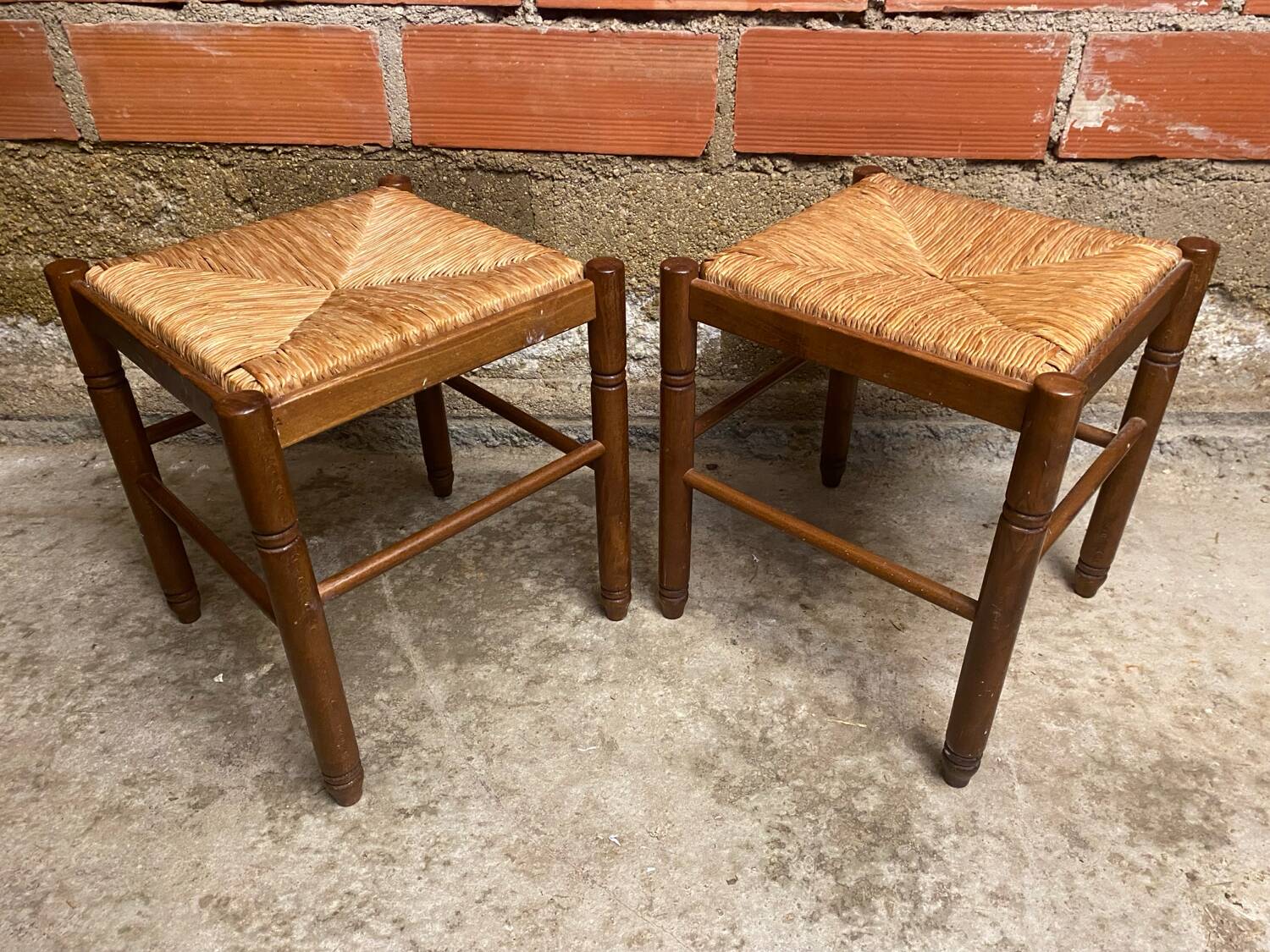 Pair of vintage wooden stools with woven straw seats