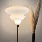 Table lamp with a matte white glass globe