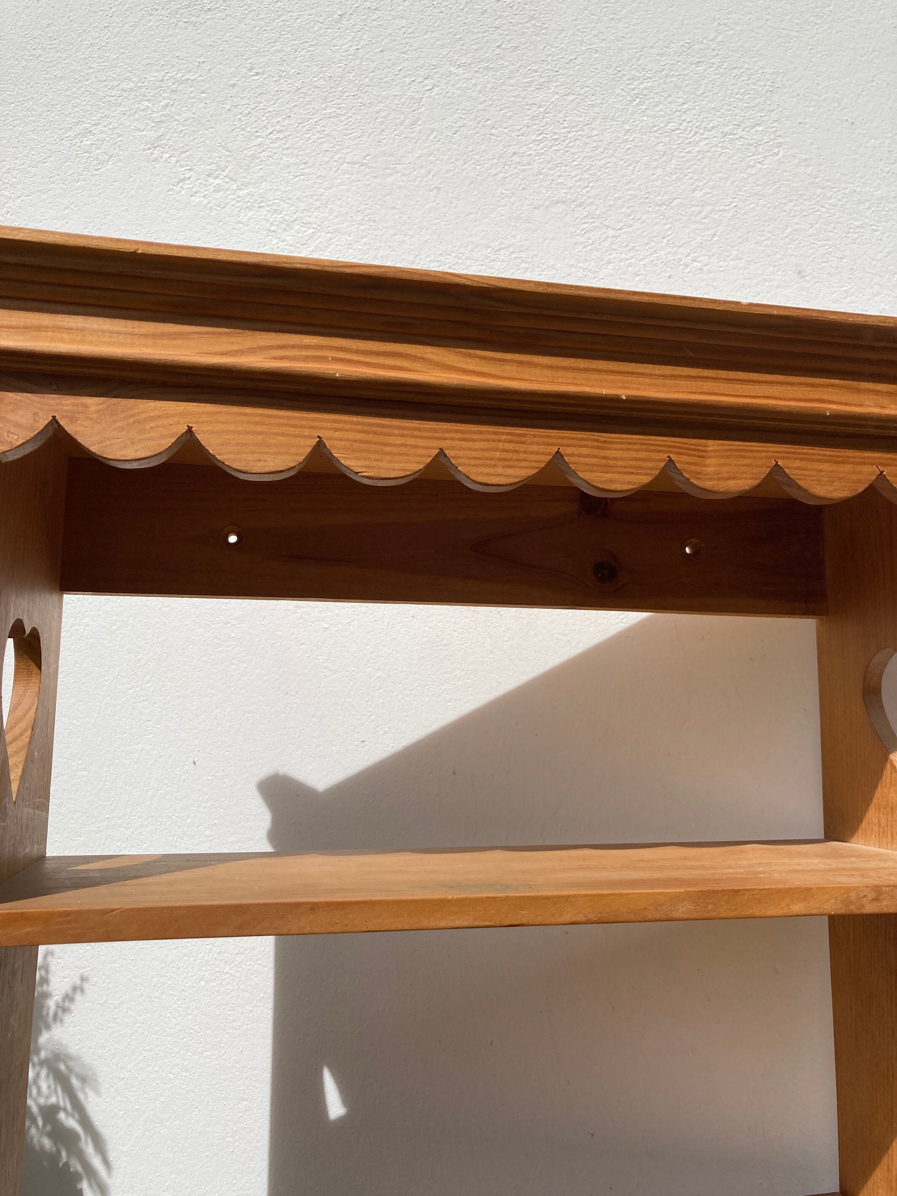 Wall shelf in raw wood with drawers and openwork hearts