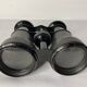 Old pair of binoculars sheathed leather black silver metal