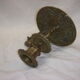 Ancient candlestick in carved bronze ram