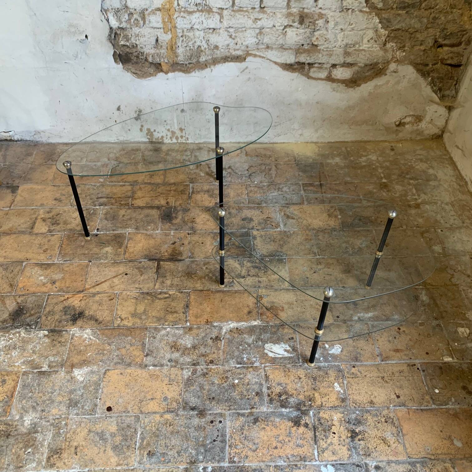 Pair of two 1950s glass and metal coffee tables, in the style of Edoardo Paoli