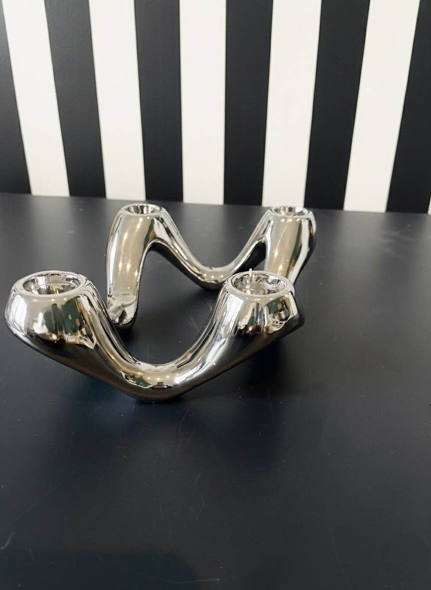 Quatra Chrome candlestick chandelier inspired by "Cobra"