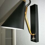 Pair of modernist sconces in black and gold metal