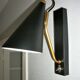 Pair of modernist sconces in black and gold metal