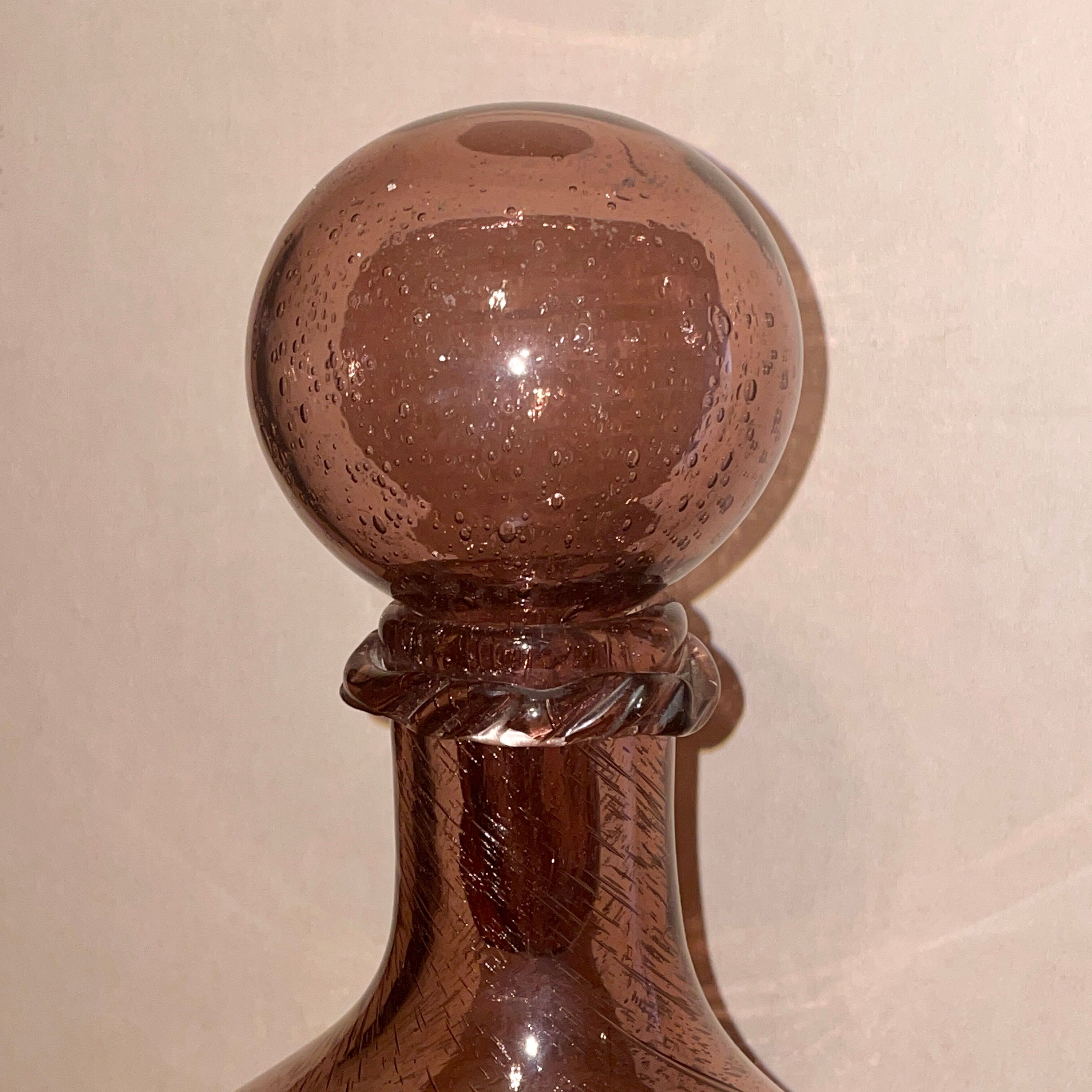Bottle  in blown and bubbled glass