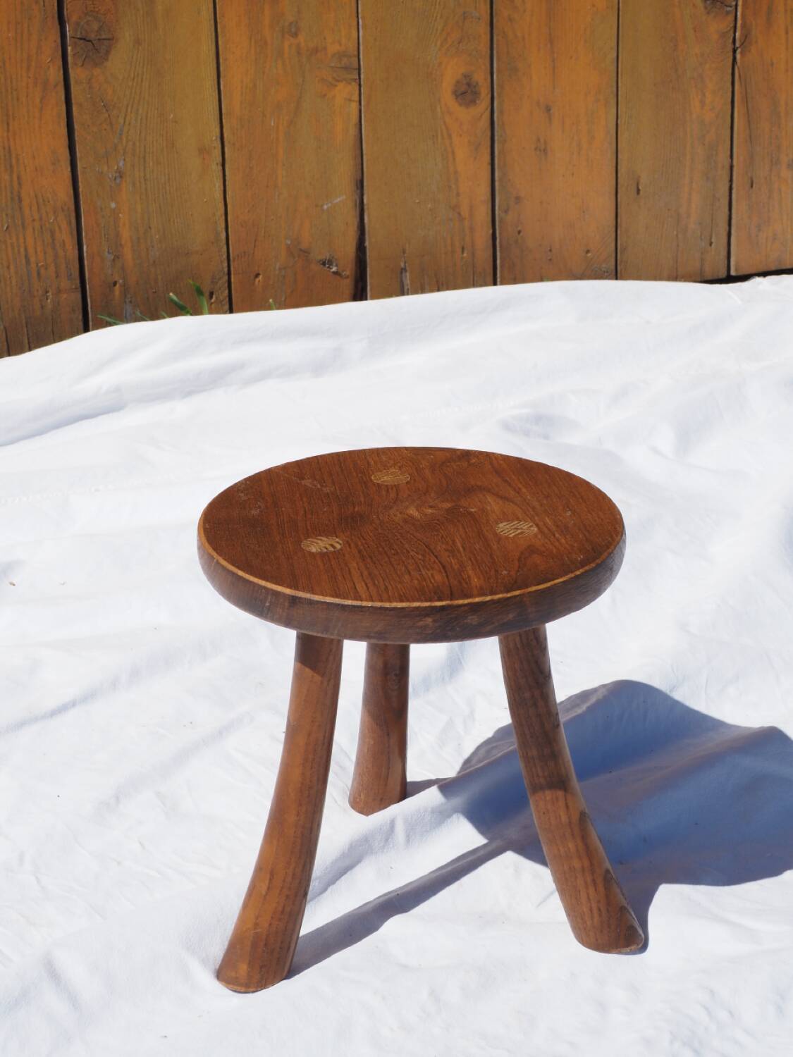 Old rustic milking stool