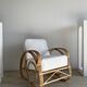 Large rattan rest chair and white cushions