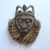 African mask with raffia and kaolin dots