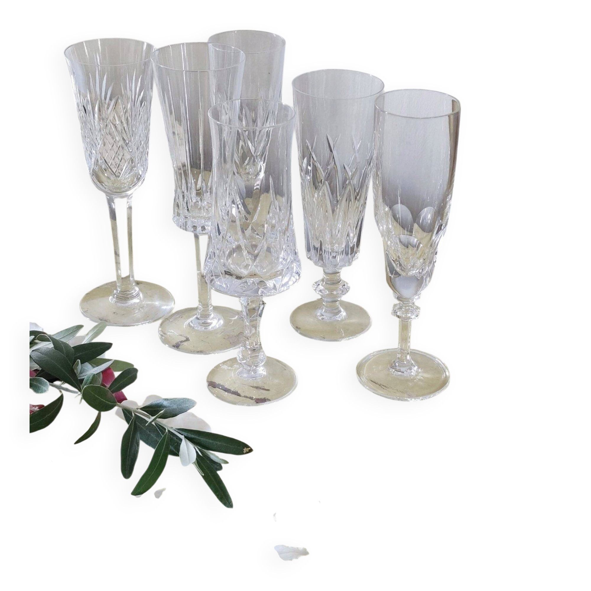 Mismatched set of prestigious crystal champagne flutes