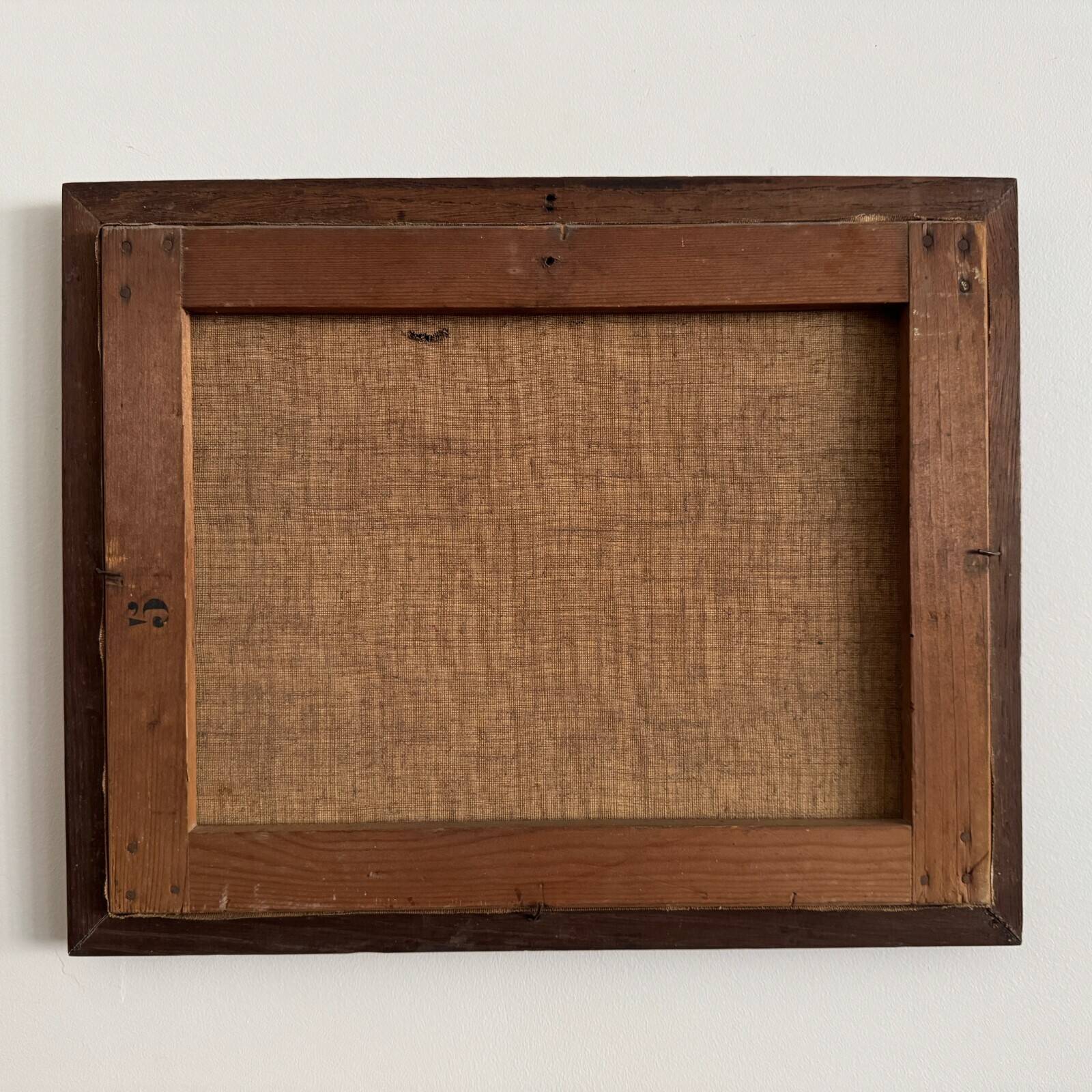 Oil on canvas park scene with a woman sitting in an armchair