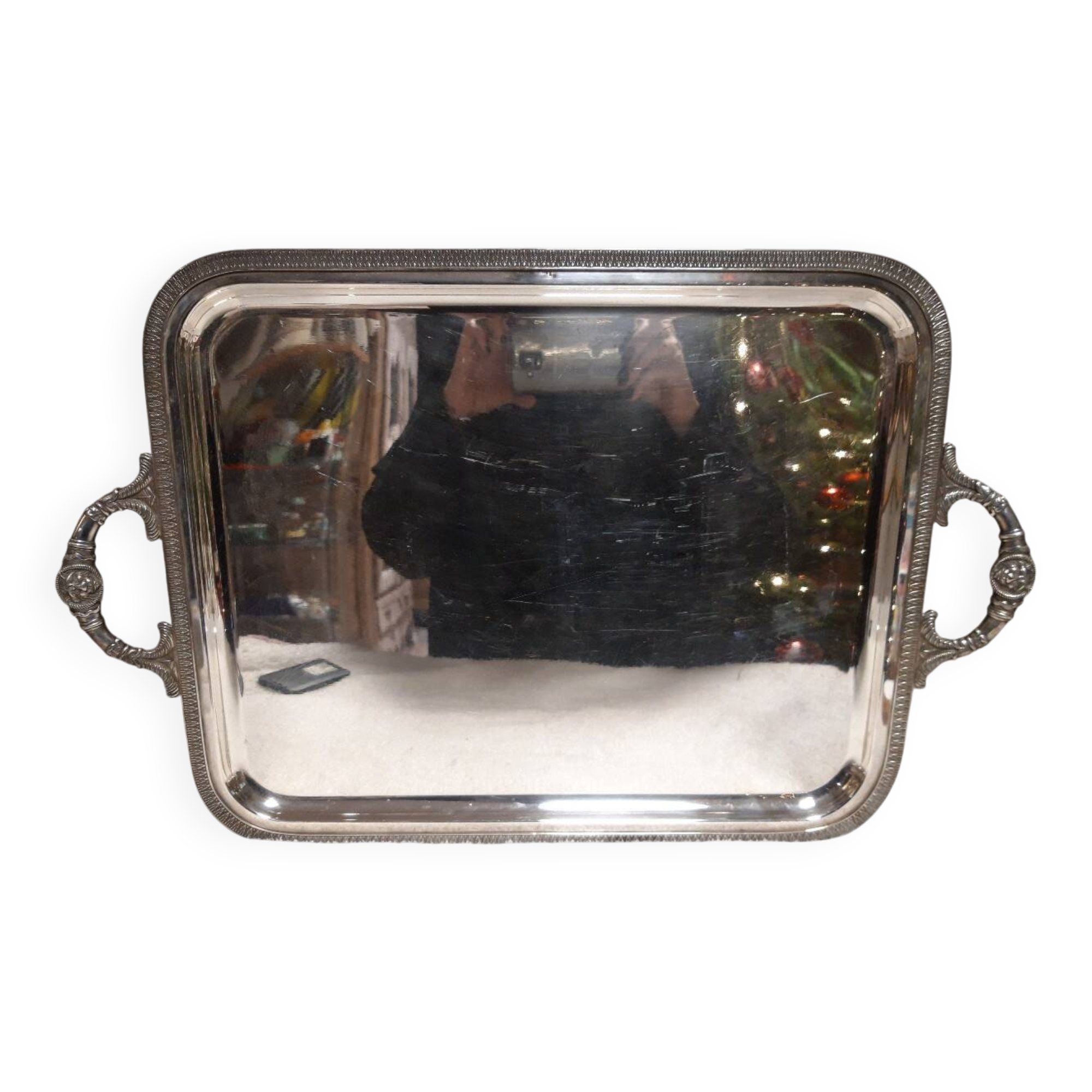 Silver-plated service tray with handles, neoclassical decoration.