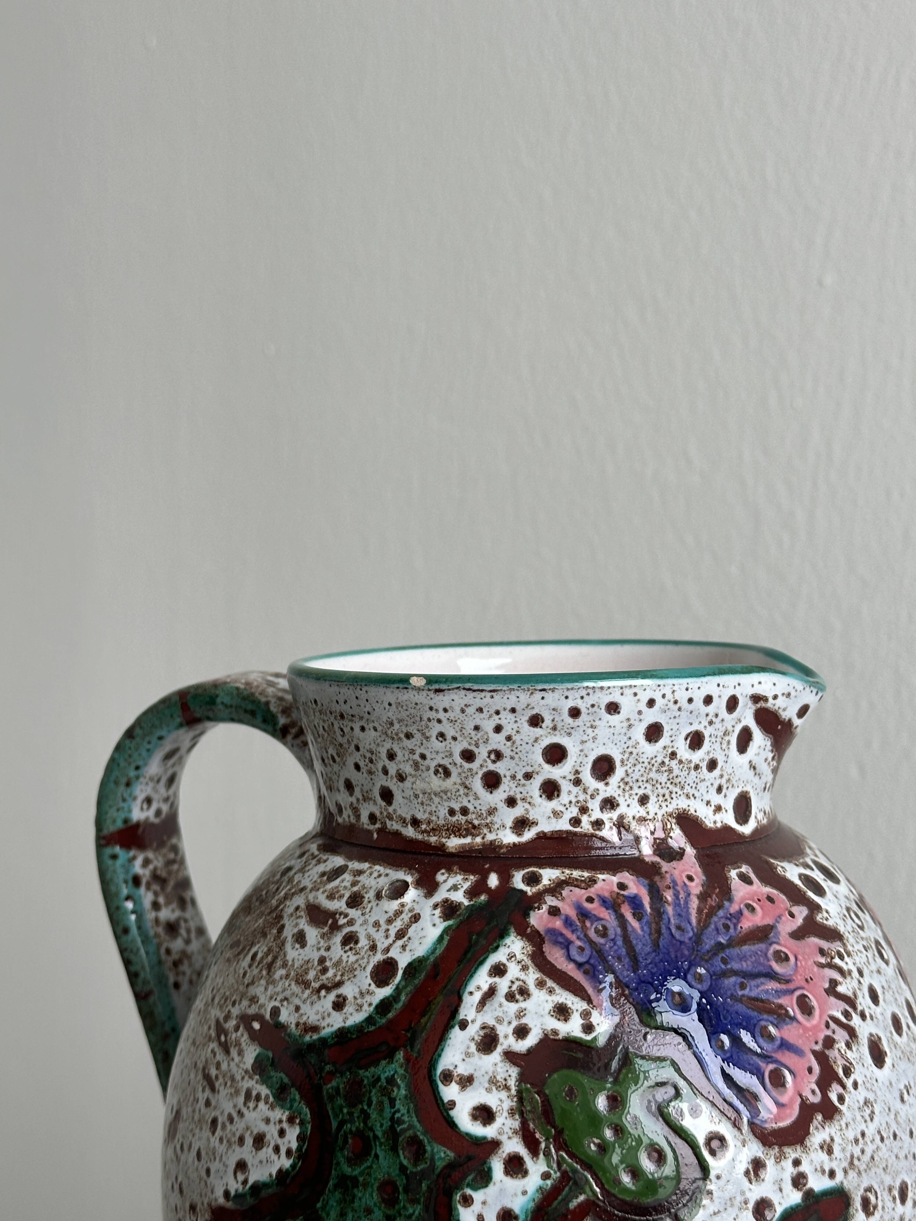 Antique decorative ceramic pitcher