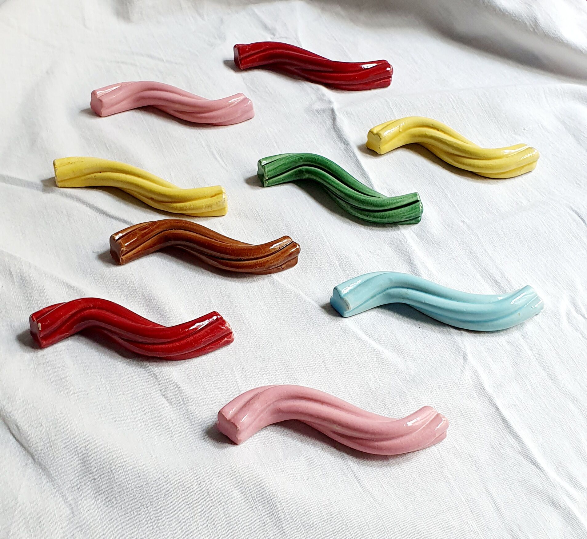 Set of 9 enamelled ceramic knife holders