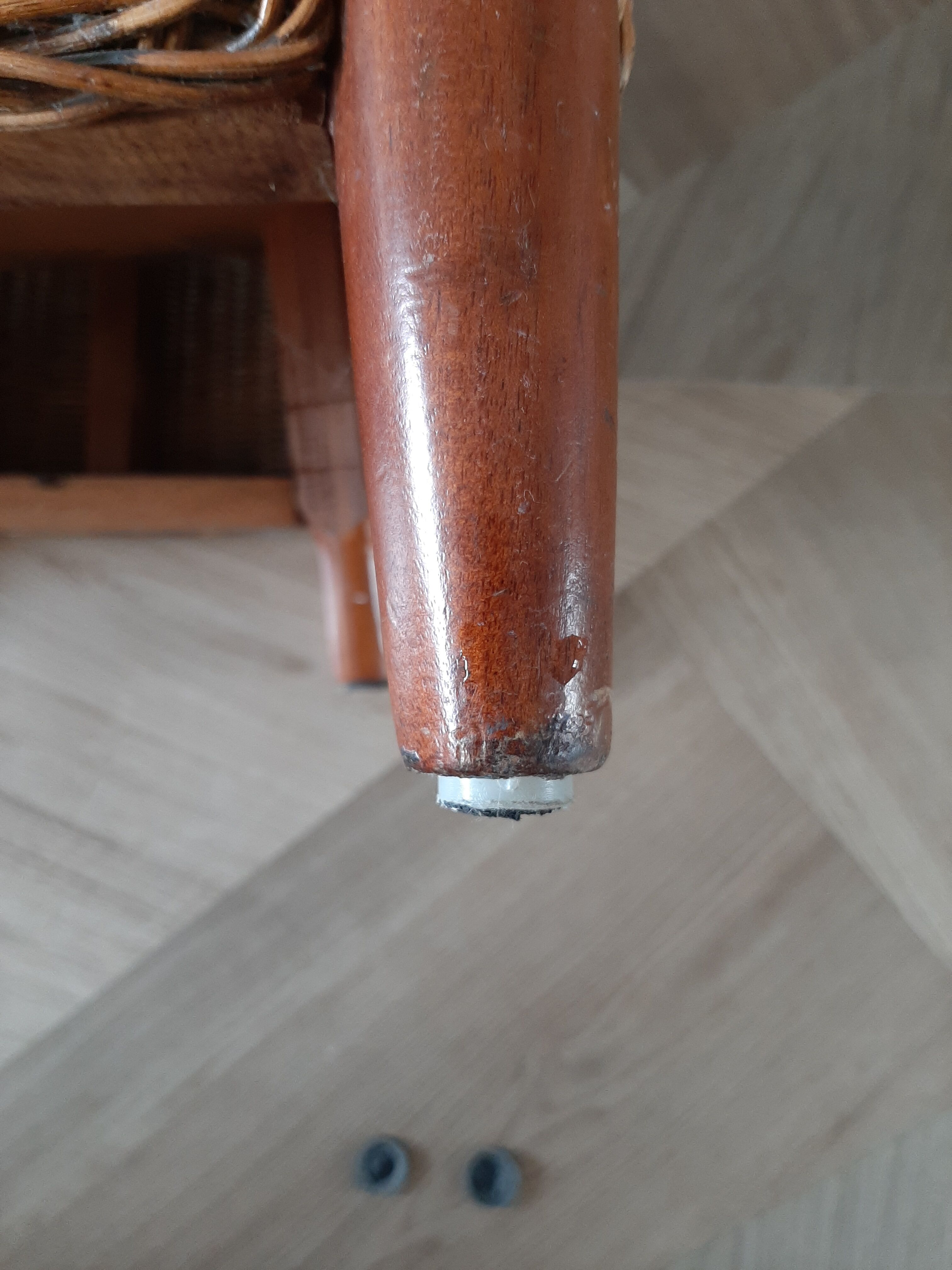 Armchair in woven rattan and exotic wood