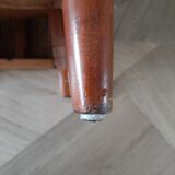 Armchair in woven rattan and exotic wood