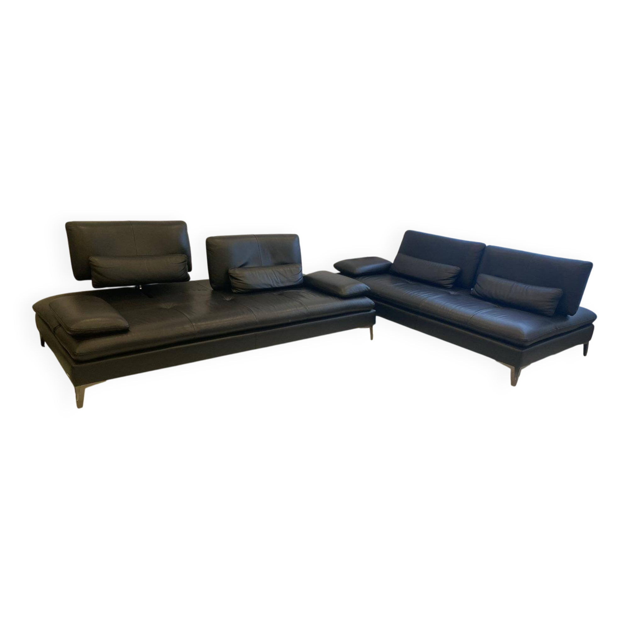 2 black leather sofas roche bobois scenario, one three-seater and one chaise longue.