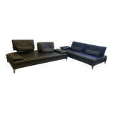 2 black leather sofas roche bobois scenario, one three-seater and one chaise longue.