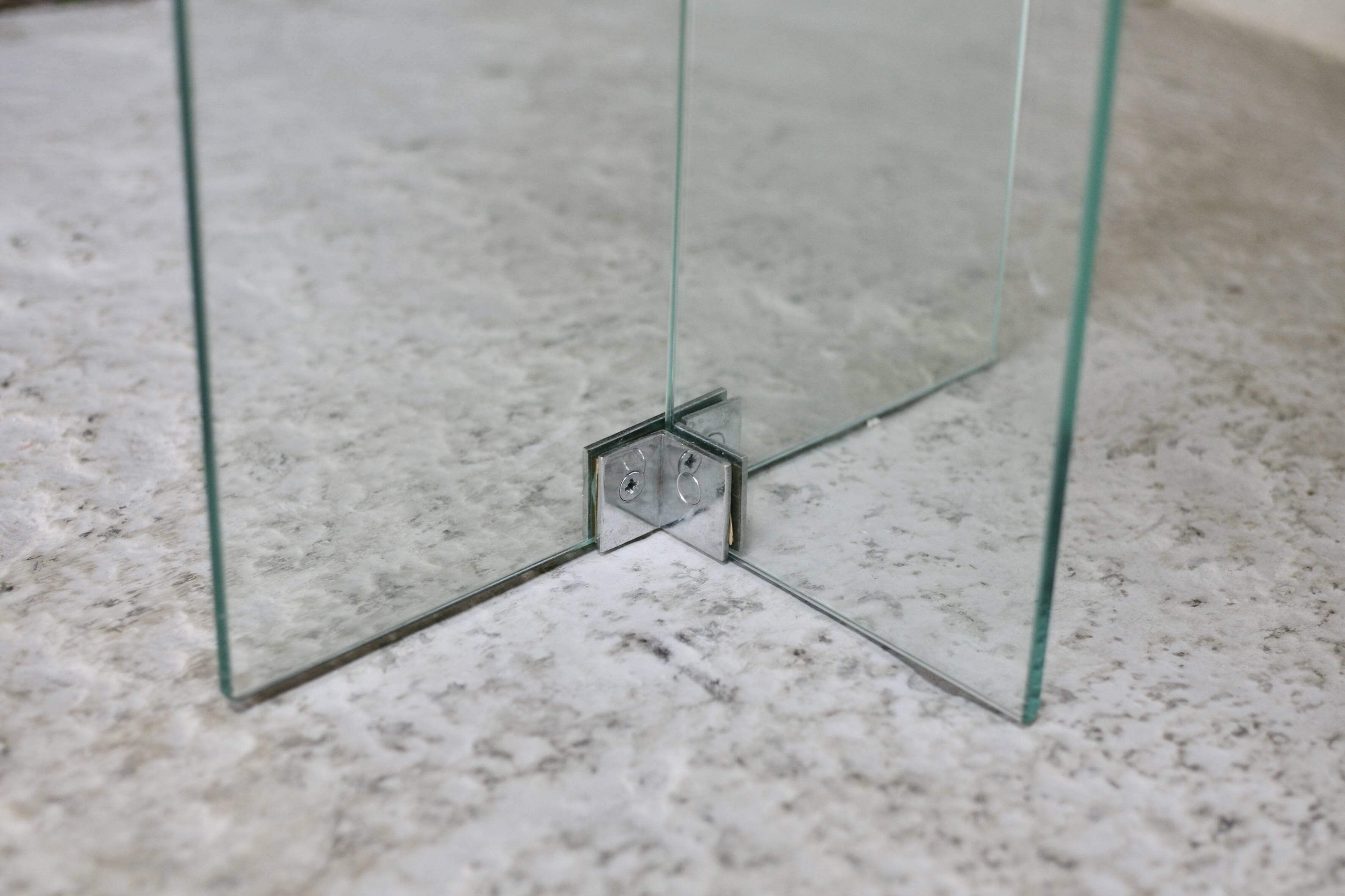 Modernist console, 1960s, glass base, wooden and fabric top.