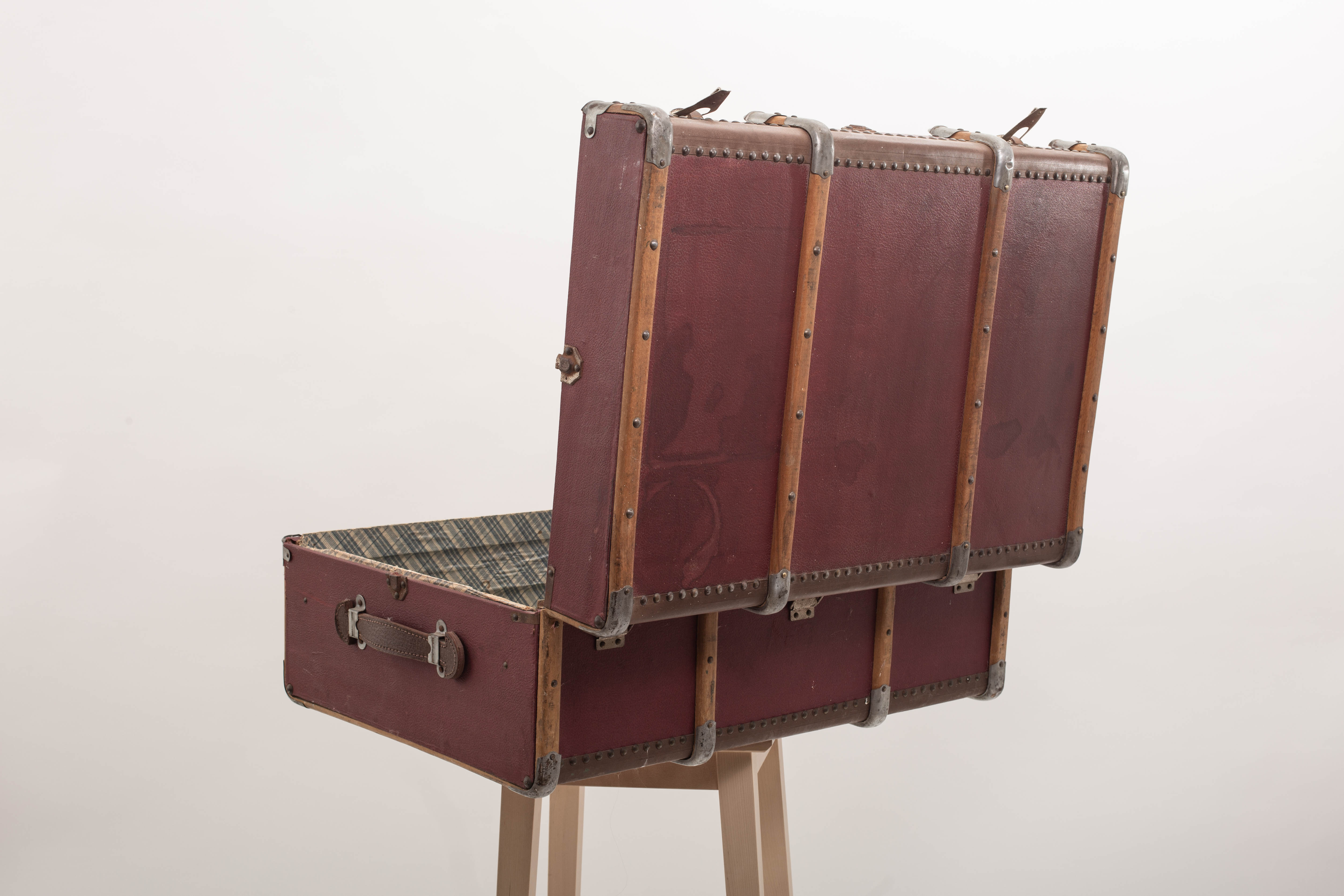 Old trunk travel suitcase burgundy color