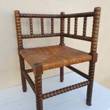 Fauteuil de coin en bois tourné façon chapelet