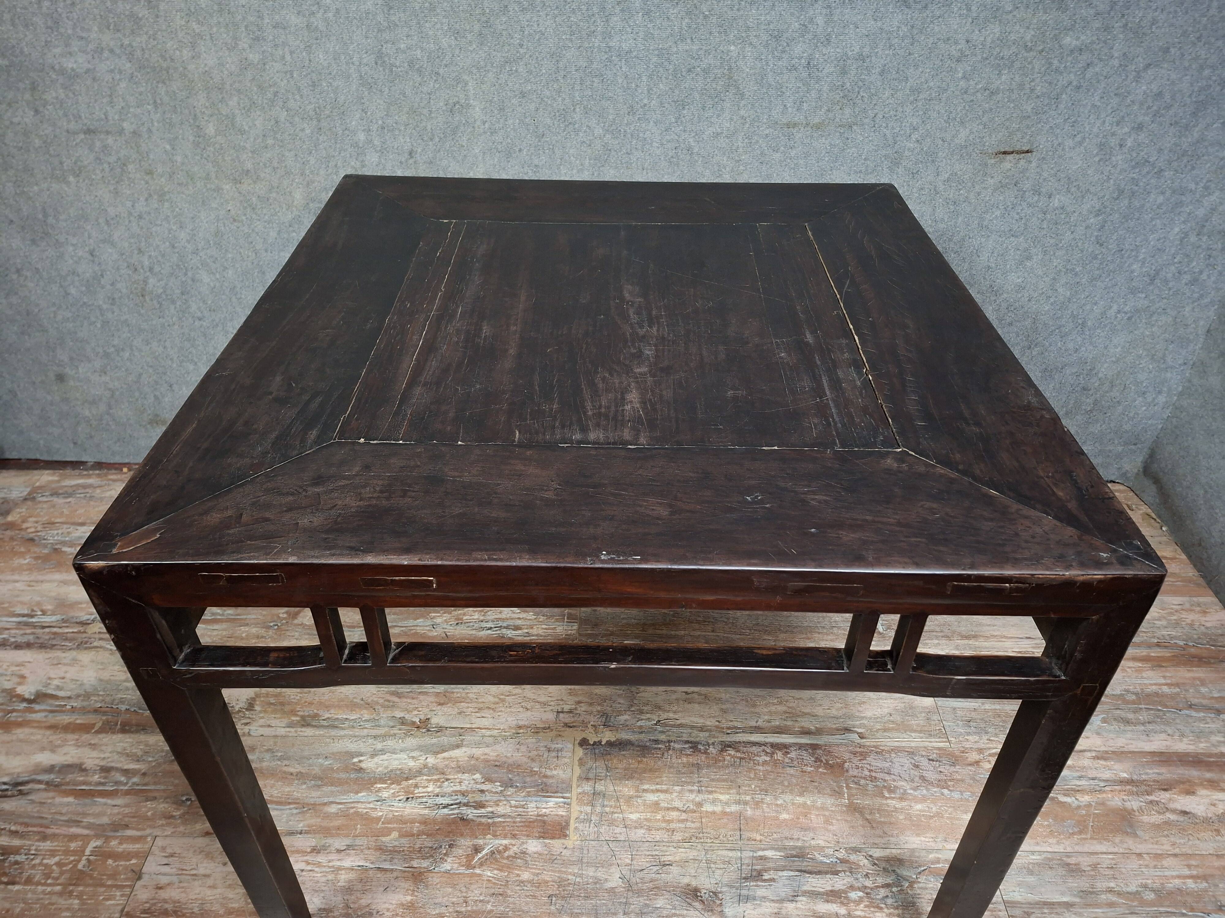 ancient Asian table, made of solid wood with a dark brown patina