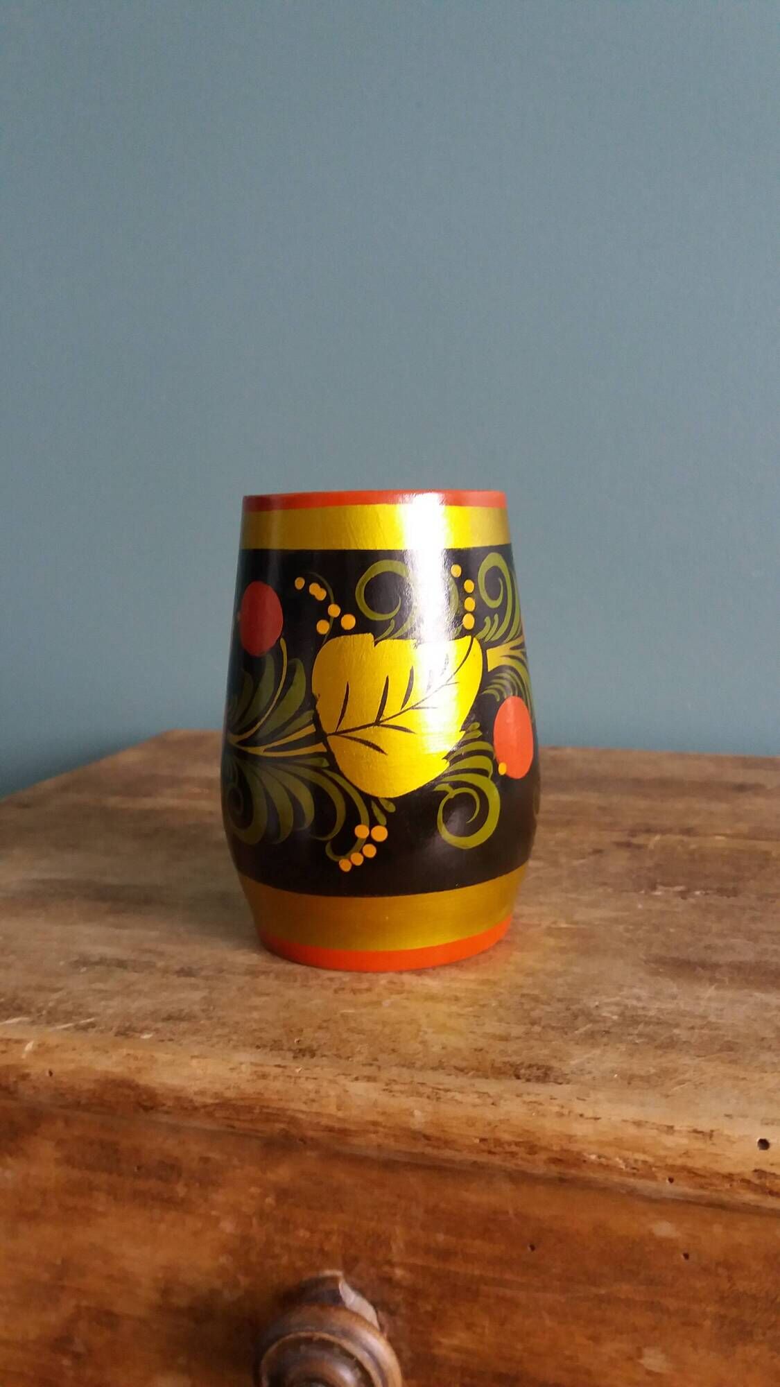 Khokhloma vase, Russian lacquered wood craftsmanship, hand-painted decoration.