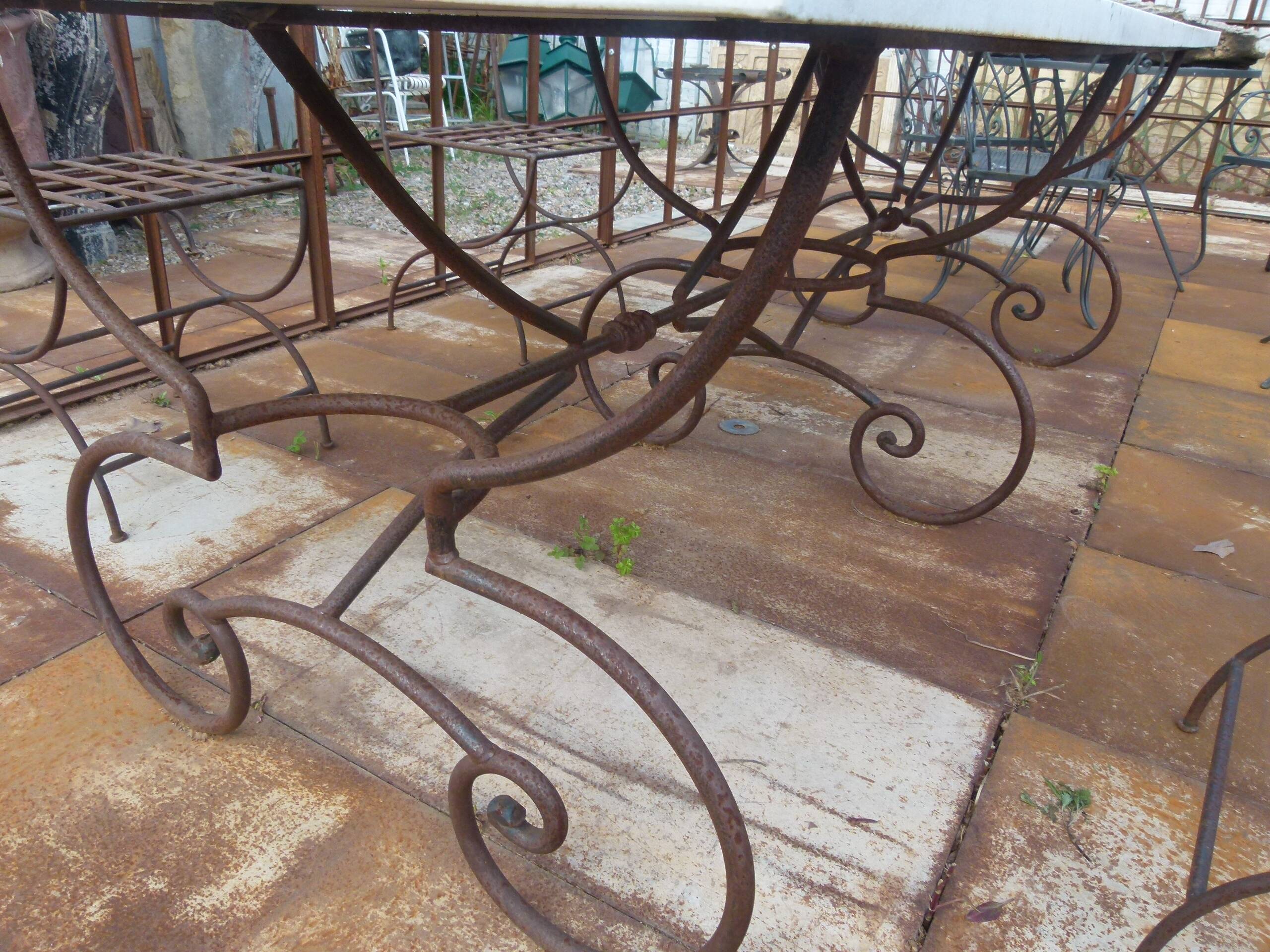 Marble table with wrought iron legs