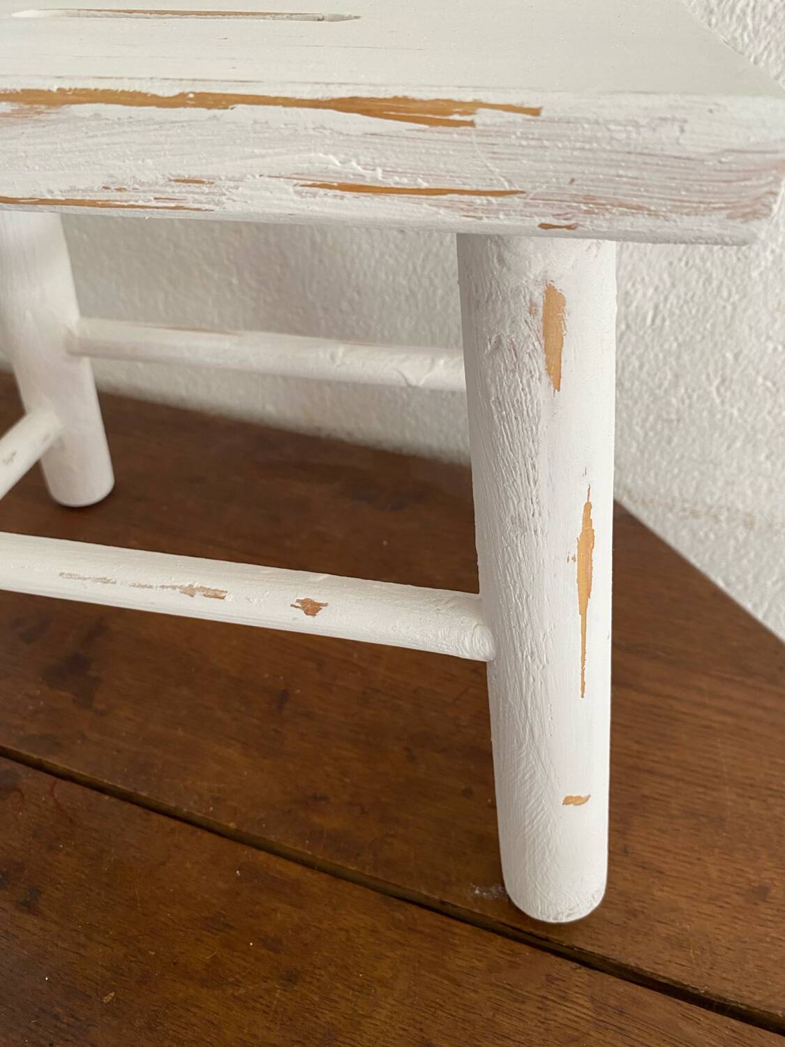 Small footrest bench in patinated white wood