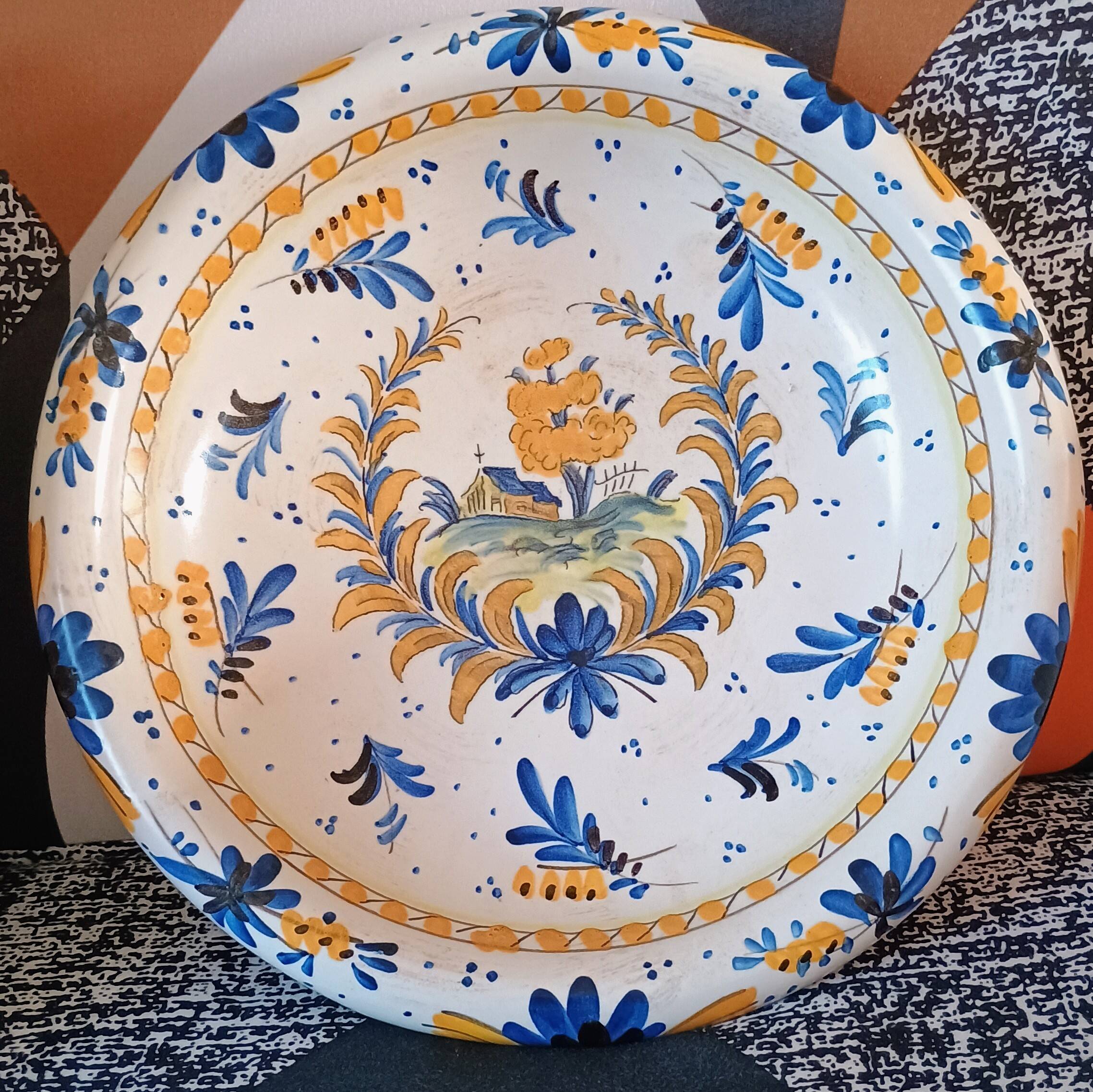 Large earthenware bowl decorated in the Rouen/Moustiers style.