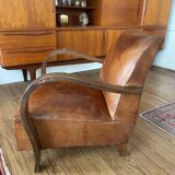 Vintage leather club chair with wooden armrests