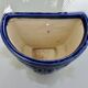 Wall pot in glazed blue terracotta with a grape design, 1970s.