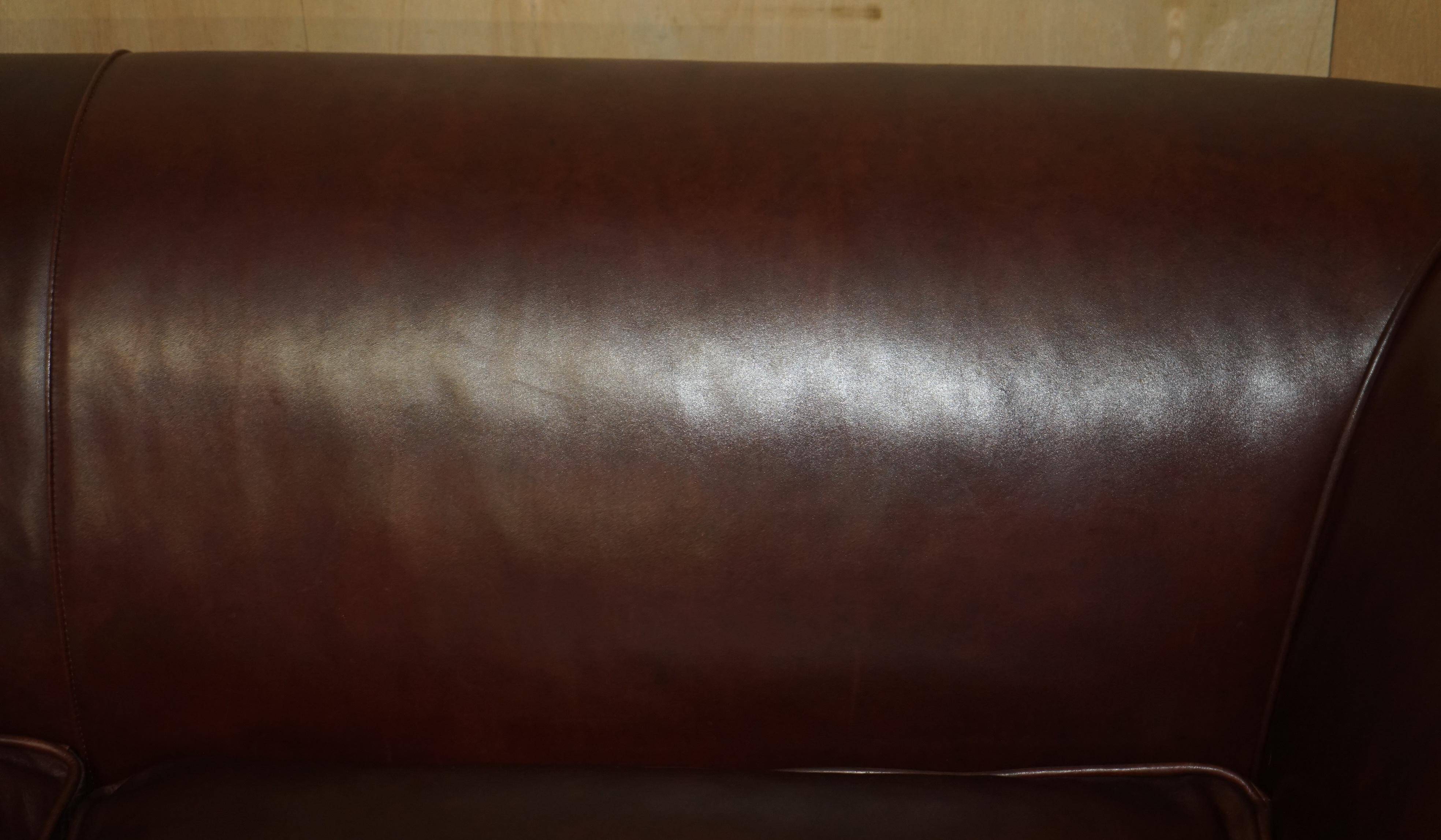 Vintage Art Deco leather sofa, three-seater, feather cushions.