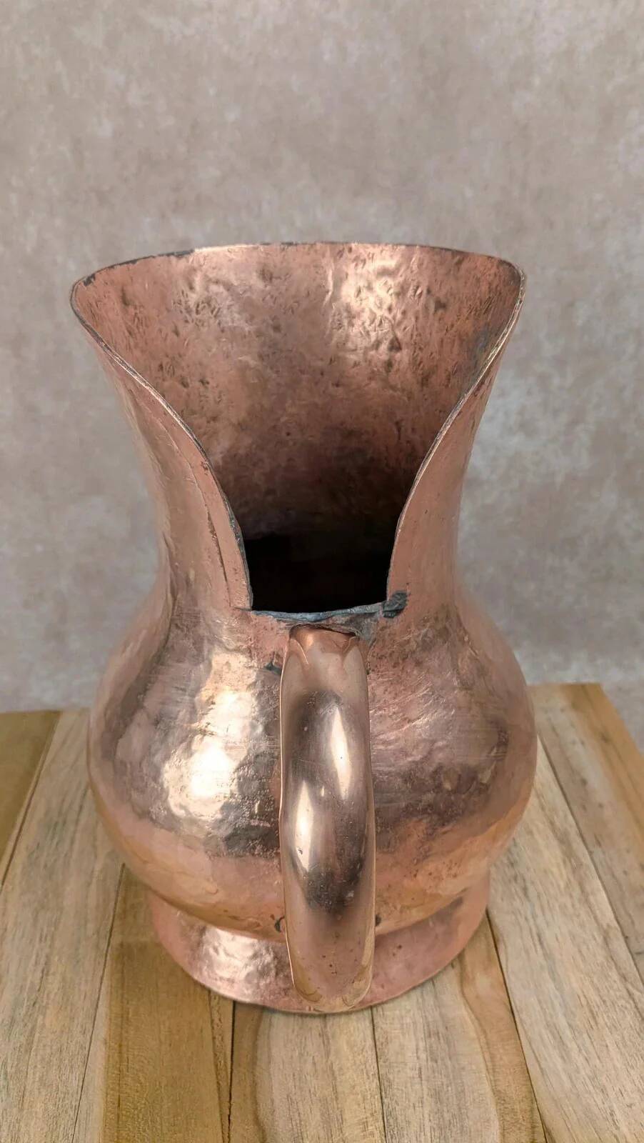 Antique hammered copper jug