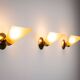 Set of three brass sconces with decorated yellow glass shades
